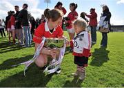 11 May 2013; Cork captain Ann Marie Walsh shows the cup to her niece Megan Walsh, aged 18 months, after the game. TESCO HomeGrown Ladies National Football League, Division 1 Final, Cork v Mayo, Parnell Park, Donnycarney, Dublin. Picture credit: Barry Cregg / SPORTSFILE