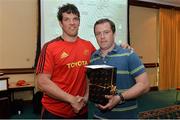 16 May 2013; Munster's Marcus Horan, who is leaving the club at the end of this season, is presented with a farewell gift, presented to him on behalf of Munster Rugby, by team-mate Donncha O'Callaghan. Munster Rugby End-of-Season Gathering 2013, Castletroy Park Hotel, Limerick. Picture credit: Diarmuid Greene / SPORTSFILE