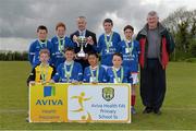 16 May 2013; Alan Kavanagh, Executive Manager, Aviva Health, presents Donal McKenny, second from left, and Liam Jackson, third from right, co-captains of Monastery N S. Ardee Co. Louth, with the cup for the Boy's Section B. Aviva Health FAI Primary School 5's, Leinster Finals, MDL Grounds, Trim Road, Navan, Co. Meath. Picture credit: Brian Lawless / SPORTSFILE