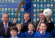 17 May 2013; An Taoiseach Enda Kenny, T.D., and Uachtarán Chumann Lúthchleas Gael Liam Ó Néill, left, and former Galway and Mayo football manager John O'Mahony, T.D., with students, from left, Caoilte O Cuanaigh, Aideen Gielty, Selina Dever and Lauren McNulty, all from Doonagh National School, Achill Island, Co. Mayo, at the official unveiling of the newly-refurbished GAA Museum at Croke Park. The final phase of renovation now includes the official GAA Hall of Fame, a modern-day heroes and legends gallery, eight exciting interactive skill zones and dedicated sound booths showcasing clips from the association’s oral history archive. The museum boasts a vast collection of objects that illustrate the development of Gaelic games from ancient times to the present day.  Admission to the GAA Museum and Stadium Tour is priced at €12.00 for an adult, €8.00 for a child under 12, €32.00 for a family, 2 adults & 2 children, and €9.00 for students and senior citizens. For further information visit www.crokepark.ie/gaa-museum or www.facebook.com/CrokePark. GAA Museum, Croke Park, Dublin. Picture credit: Ray McManus / SPORTSFILE