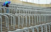 18 May 2013; A lone spectator in the uncovered stand shortly before the game. Leinster GAA Hurling Senior Championship, First Round, Laois v Antrim, O'Moore Park, Portlaoise, Co. Laois. Picture credit: Diarmuid Greene / SPORTSFILE