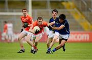 19 May 2013; Conor Martin, Armagh, in action against Mark Magee, Cavan. Electric Ireland Ulster GAA Football Minor Championship, First Round, Cavan v Armagh, Kingspan Breffni Park, Cavan. Picture credit: Ray McManus / SPORTSFILE