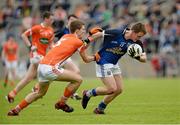 19 May 2013; Tom Hayes, Cavan, in action against Shea Heffron, Armagh. Electric Ireland Ulster GAA Football Minor Championship, First Round, Cavan v Armagh, Kingspan Breffni Park, Cavan. Picture credit: Oliver McVeigh / SPORTSFILE