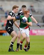 19 May 2013; Eamon Tiernan, Mayo, in action against Kevin McDonnell, left, and Cathal Byrne, Sligo. Connacht GAA Football Junior Championship Final, Mayo v Sligo, Pearse Stadium, Salthill, Galway. Picture credit: Diarmuid Greene / SPORTSFILE