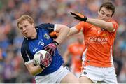 19 May 2013; James McEnroe, Cavan, in action against Brendan Donaghy, Armagh. Ulster GAA Football Senior Championship, Preliminary Round, Cavan v Armagh, Kingspan Breffni Park, Cavan. Picture credit: Oliver McVeigh / SPORTSFILE