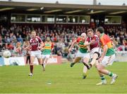 19 May 2013; Kieran Martin, Westmeath, scores his second goal against Carlow despite the tackle of Shane Mernagh. Leinster GAA Football Senior Championship, First Round, Westmeath v Carlow, Cusack Park, Mullingar, Co. Westmeath. Picture credit: Matt Browne / SPORTSFILE