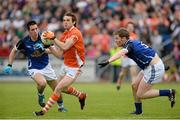 19 May 2013; Kevin Dyas, Armagh, in action against Barry Reilly, left, and Rory Dunne, Cavan. Ulster GAA Football Senior Championship, Preliminary Round, Cavan v Armagh, Kingspan Breffni Park, Cavan. Picture credit: Oliver McVeigh / SPORTSFILE