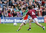 19 May 2013; Enda Varley, Mayo, shoots to score his side's second goal, despite the efforts of Gary Sweeney, Galway. Connacht GAA Football Senior Championship Quarter-Final, Galway v Mayo, Pearse Stadium, Galway. Picture credit: Brian Lawless / SPORTSFILE