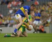 5 July 2003; Kevin Cassidy, Donegal, in action against Tipperary's Aidan Fitzgerald. Bank of Ireland Senior Football Championship qualifier Round 3, Tipperary v Donegal, Croke Park, Dublin. Picture credit; Ray McManus / SPORTSFILE
