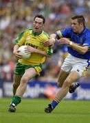 5 July 2003; Brendan Devenny, Donegal, in action against Tipperary's Robbie Costigan. Bank of Ireland Senior Football Championship qualifier Round 3, Tipperary v Donegal, Croke Park, Dublin. Picture credit; Ray McManus / SPORTSFILE
