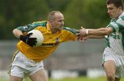 6 July 2003; Ollie Murphy, Meath, in action against Fermanagh's Ryan McCloskey. Bank of Ireland Senior Football Championship qualifier Round 3, Fermanagh v Meath, St. Tighearnach's Park, Clones, Monaghan. Picture credit; Matt Browne / SPORTSFILE *EDI*