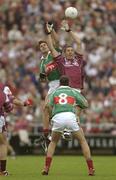 6 July 2003; Galway's Kevin Walsh goes up for a high ball with Mayo's James Gill. Bank of Ireland Connacht Senior Football Championship Final, Galway v Mayo, Pearse Stadium, Galway. Picture credit; Damien Eagers / SPORTSFILE *EDI*