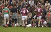 6 July 2003; Paul Clancy, Galway, and Roscommon's Fergal Costello pictured lying injured after a collision. Bank of Ireland Connacht Senior Football Championship Final, Galway v Mayo, Pearse Stadium, Galway. Picture credit; Damien Eagers / SPORTSFILE *EDI*