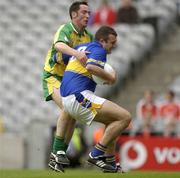 5 July 2003; Tipperary's Fergal O'Callaghan in action against Donegal's Brendan Devenney. Bank of Ireland Senior Football Championship Qualifier Round 3, Tipperary v Donegal, Croke Park, Dublin. Picture credit; Damien Eagers / SPORTSFILE