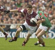 6 July 2003; Michael Meehan, Galway, in action against Mayo's David Heaney. Bank of Ireland Connacht Senior Football Championship Final, Galway v Mayo, Pearse Stadium, Galway. Picture credit; David Maher / SPORTSFILE *EDI*