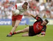 13 July 2003; Brian McGuigan, Tyrone, in action against Down's Ronan Murtagh. Bank of Ireland Ulster Senior Football Final, Tyrone v Down, St. Tighernach's Park, Clones, Co Monaghan. Picture credit; Damien Eagers / SPORTSFILE *EDI*