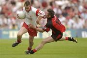 13 July 2003; Brian McGuigan, Tyrone, in action against Down's Ronan Murtagh. Bank of Ireland Ulster Senior Football Final, Tyrone v Down, St. Tighernach's Park, Clones, Co Monaghan. Picture credit; Damien Eagers / SPORTSFILE *EDI*