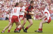 13 July 2003; Down's Dan Gordon in action against Tyrone's Brian McGuigan, (11) and Chris Lawn. Bank of Ireland Ulster Senior Football Final, Tyrone v Down, St. Tighernach's Park, Clones, Co Monaghan. Picture credit; Damien Eagers / SPORTSFILE *EDI*
