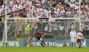 13 July 2003; Peter Canavan, Tyrone, beats Down goalkeeper Michael McVeigh from the penalty spot to score his sides only goal. Bank of Ireland Ulster Senior Football Final, Tyrone v Down, St. Tighernach's Park, Clones, Co Monaghan. Picture credit; David Maher / SPORTSFILE *EDI*