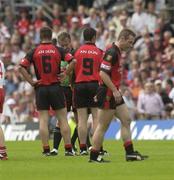 13 July 2003; Referee Aidan Mangan holds the red card after sending off Down's no. 9, Gregory McCartan. Bank of Ireland Ulster Senior Football Final, Tyrone v Down, St. Tighernach's Park, Clones, Co Monaghan. Picture credit; David Maher / SPORTSFILE *EDI*