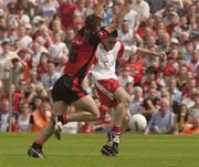 13 July 2003; Ryan McMenamin, Tyrone, in action against Down's Ronan Murtagh. This was the last kick of the game and went wide. Bank of Ireland Ulster Senior Football Final, Tyrone v Down, St. Tighernach's Park, Clones, Co Monaghan. Picture credit; Damien Eagers / SPORTSFILE *EDI*
