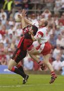 13 July 2003; Peter Canavan, Tyrone, in action against Down's Martin Cole. Bank of Ireland Ulster Senior Football Final, Tyrone v Down, St. Tighernach's Park, Clones, Co Monaghan. Picture credit; David Maher / SPORTSFILE *EDI*