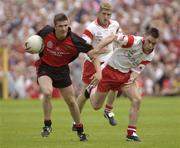 13 July 2003; Down's Ronan Murtagh in action against Tyrone's Ryan McMenamin. Bank of Ireland Ulster Senior Football Final, Tyrone v Down, St. Tighernach's Park, Clones, Co Monaghan. Picture credit; Damien Eagers / SPORTSFILE *EDI*