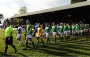 21 October 2017; The teams make their way to the pitch before the Shinty International match between Ireland and Scotland at Bught Park in Inverness, Scotland. Photo by Piaras Ó Mídheach/Sportsfile