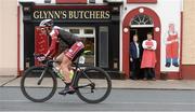 20 May 2013; Butcher John Glynn an his mother Eileen watch competitors in action in Ahascragh, Co. Galway during Stage 2 of the 2013 An Post Rás. Longford - Nenagh. Photo by Sportsfile