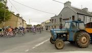 20 May 2013; A general view of competitors making their way through Athleague, Co. Roscommon, during Stage 2 of the 2013 An Post Rás. Longford - Nenagh. Photo by Sportsfile
