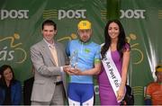 20 May 2013; John Ryan, IT Manager An Post and Miss An Post Rás Aideen Cleary present the county jersey to Fraser Duncan, Dublin West Eurocycles, after Stage 2 of the 2013 An Post Rás. Longford - Nenagh. Photo by Sportsfile