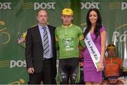 20 May 2013; David Moran, branch manager, and Miss An Post Rás Aideen Cleary present the Points Leader jersey to Shane Archbold, An Post Chain Reaction, after Stage 2 of the 2013 An Post Rás, Longford - Nenagh. Photo by Sportsfile