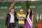 20 May 2013; Donal Connell, CEO An Post and Miss An Post Rás Aideen Cleary present the yellow jersey to Peter Hawkins, Team IG Sigma Sport. Stage 2 of the 2013 An Post Rás, Longford - Nenagh. Nenagh, Co. Tipperary. Photo by Sportsfile