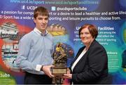 20 May 2013; Martin Mulkerrins is presented with the Sports Person of the Year award by Dr, Marjorie Fitzpatrick, sister of the late Dr. O'Neill, at the UCD Sports Awards 2013. UCD Sports Awards 2013, Astra Hall, University College Dublin, Belfield, Dublin. Picture credit: Barry Cregg / SPORTSFILE