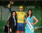 21 May 2013; Mary O'Connell, branch manager, and Miss An Post Rás Eibhlis Moriarty, present the yellow jersey to Marcin Bialoblocki, Britain UK Youth Pro Cycling, after Stage 3 of the 2013 An Post Rás between Nenagh and Listowel. Listowel, Co. Kerry. Photo by Sportsfile