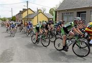 21 May 2013; Eventual stage winner Sam Bennett, second from right, An Post Chain Reaction, passes through the village of Athea, Co. Limerick, during Stage 3 of the 2013 An Post Rás. Nenagh - Listowel. Photo by Sportsfile