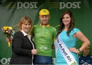 21 May 2013; Mary Byrne, Delivery Services manager An Post, and Miss An Post Rás Eibhlis Moriarty present Owain Doull, Great Britain National Team, with the An Post points leader jersey after Stage 3 of the 2013 An Post Rás between Nenagh and Listowel. Listowel, Co. Kerry. Photo by Sportsfile