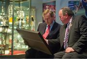 17 May 2013; An Taoiseach Enda Kenny, T.D., and Uachtarán Chumann Lúthchleas Gael Liam Ó Néill look at a replica of the 1936 All-Ireland Football Final match programme, which was presented to the Taoiseach, at the official unveiling of the newly-refurbished GAA Museum at Croke Park. The final phase of renovation now includes the official GAA Hall of Fame, a modern-day heroes and legends gallery, eight exciting interactive skill zones and dedicated sound booths showcasing clips from the association’s oral history archive. The museum boasts a vast collection of objects that illustrate the development of Gaelic games from ancient times to the present day.  Admission to the GAA Museum and Stadium Tour is priced at €12.00 for an adult, €8.00 for a child under 12, €32.00 for a family, 2 adults & 2 children, and €9.00 for students and senior citizens. For further information visit www.crokepark.ie/gaa-museum or www.facebook.com/CrokePark. GAA Museum, Croke Park, Dublin. Picture credit: Brendan Moran / SPORTSFILE
