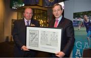 17 May 2013; Uachtarán Chumann Lúthchleas Gael Liam Ó Néill makes a presentation of a replica of the 1936 All-Ireland Football Final match programme to An Taoiseach Enda Kenny, T.D., at the official unveiling of the newly-refurbished GAA Museum at Croke Park. The final phase of renovation now includes the official GAA Hall of Fame, a modern-day heroes and legends gallery, eight exciting interactive skill zones and dedicated sound booths showcasing clips from the association’s oral history archive. The museum boasts a vast collection of objects that illustrate the development of Gaelic games from ancient times to the present day.  Admission to the GAA Museum and Stadium Tour is priced at €12.00 for an adult, €8.00 for a child under 12, €32.00 for a family, 2 adults & 2 children, and €9.00 for students and senior citizens. For further information visit www.crokepark.ie/gaa-museum or www.facebook.com/CrokePark. GAA Museum, Croke Park, Dublin. Picture credit: Brendan Moran / SPORTSFILE