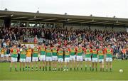 19 May 2013; The Carlow team stand for a minute's silence before the start of the match for former GAA President Paddy Buggy. Leinster GAA Football Senior Championship, First Round, Westmeath v Carlow, Cusack Park, Mullingar, Co. Westmeath. Picture credit: Matt Browne / SPORTSFILE