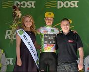 22 May 2013; Miss An Post Rás Therese Hurley and Jonathan Barry, Corporate Sales, present Michael Cuming, Rapha Condor JLT, with the King of the Mountains jersey after Stage 4 of the 2013 An Post Rás. Listowel - Glengarriff. Glengarriff, Co. Cork. Photo by Sportsfile