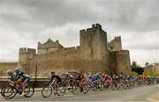 24 May 2013; A general view of the peleton going past Cahir Castle, Co. Tipperary, during Stage 6 of the 2013 An Post Rás. Mitchelstown – Carlow. Photo by Sportsfile