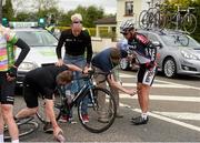 24 May 2013; Race doctor Conor McGrane attends to Kirill Pozdnyakov, Synergy Baku, after an accident before Horse and Jockey, Co. Tipperary, during Stage 6 of the 2013 An Post Rás. Mitchelstown – Carlow. Photo by Sportsfile
