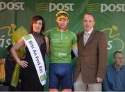 24 May 2013; Owain Doull, Great Britain National Team, is presented with the points leader jersey by Miss An Post Rás Cora Brennan and Joe Bartley, Mails Operation Manager, after stage 6 of the 2013 An Post Rás. Mitchelstown – Carlow. Photo by Sportsfile