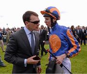 25 May 2013; Jockey Joseph O'Brien in conversation with his father, trainer Aidan O'Brien, after winning the Tattersalls Irish 2,000 Guineas with Magician. Curragh Racecourse, The Curragh, Co. Kildare. Picture credit: Ray McManus / SPORTSFILE