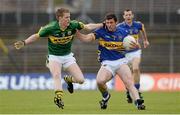 26 May 2013; Tommy Ryan, Tipperary, in action against Aidan Walsh, Kerry. Munster GAA Football Junior Championship, Quarter-Final, Kerry v Tipperary, Fitzgerald Stadium, Killarney, Co. Kerry. Picture credit: Diarmuid Greene / SPORTSFILE