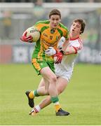 26 May 2013; Aiden Sweeney, Donegal, in action against David Mulgrew, Tyrone. Electric Ireland Ulster GAA Football Minor Championship, Quarter-Final, Donegal v Tyrone, MacCumhaill Park, Ballybofey, Co. Donegal. Picture credit: Oliver McVeigh / SPORTSFILE