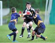 26 May 2013; Tadhg Hagan, Lurgan, Co. Cavan, centre, is tackled by John Devine, right, and Shane Fitzpatrick, Ballinasloe, Co. Galway, in the mixed U11 Mini Rugby competition. Community Games May Festival 2013, Athlone Institute of Technology, Athlone, Co. Westmeath. Picture credit: Pat Murphy / SPORTSFILE