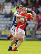 26 May 2013; Paddy Keenan, Louth, in action against Padraig McMahon, Laois. Leinster GAA Football Senior Championship, First Round, Laois v Louth, O'Moore Park, Portlaoise, Co. Laois. Picture credit: Dáire Brennan / SPORTSFILE