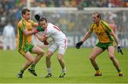 26 May 2013; Mark Donnelly, Tyrone, in action against Eamonn McGee, left, and Neil Gallagher, Donegal. Ulster GAA Football Senior Championship, Quarter-Final, Donegal v Tyrone, MacCumhaill Park, Ballybofey, Co. Donegal. Picture credit: Oliver McVeigh / SPORTSFILE